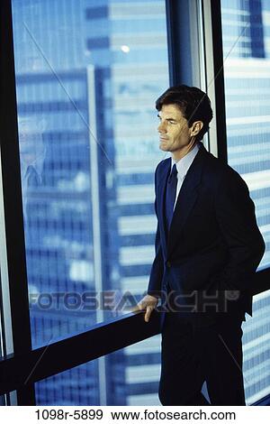 business, Middle-aged, contemplating, businessman, indoors, executive View Large Photo Image Stock Photo - business, Middle-aged, contemplating, businessman, indoors, executive. Fotosearch