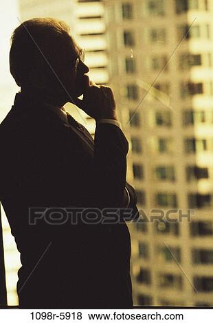 Stock Photo - business, Middle-aged, contemplating, businessman, indoors, executive. Fotosearch