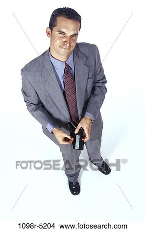 business, wallet, businessman, indoors, metaphor, Caucasian View Large Photo Image Picture - business, wallet, businessman, indoors, metaphor, Caucasian. Fotosearch
