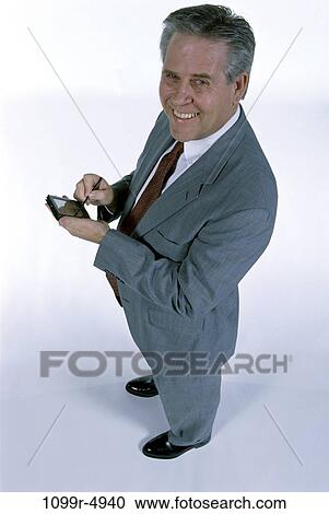 computer, business, Middle-aged, using, businessman, indoors View Large Photo Image Stock Image - computer, business, Middle-aged, using, businessman, indoors. Fotosearch
