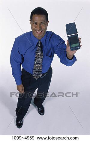 computer, holding, business, Middle-aged, businessman, hold View Large Photo Image Stock Photo - computer, holding, business, Middle-aged, businessman, hold. Fotosearch