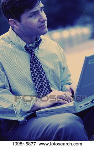 computer, laptop, business, outdoors, Middle-aged, contemplating View Large Photo Image Stock Photo - computer, laptop, business, outdoors, Middle-aged, contemplating. Fotosearch