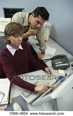 desk, computer, business, Middle-aged, serious, using, casual View Large Photo Image Picture - desk, computer, business, Middle-aged, serious, using, casual. Fotosearch