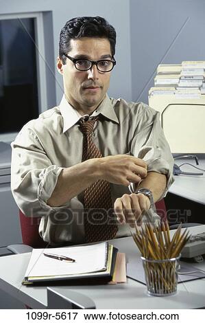 desk, eyeglasses, Hispanic, business, casual, businessman View Large Photo Image Stock Photo - desk, eyeglasses, Hispanic, business, casual, businessman. Fotosearch