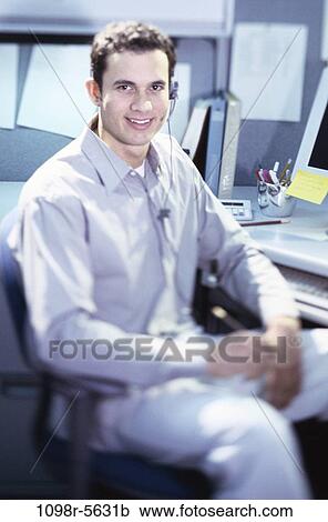 Stock Image - desk, headset, business, casual, businessman, customer service. Fotosearch