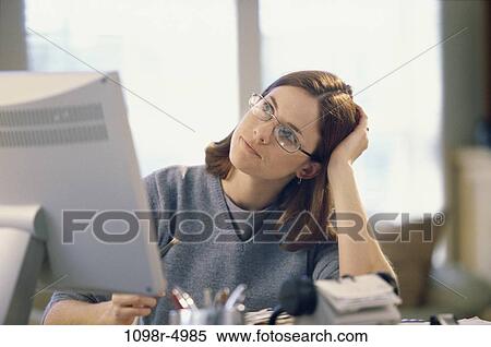 desk, woman, eyeglasses, daydreaming, computer, business, thinking View Large Photo Image Stock Photography - desk, woman, eyeglasses, daydreaming, computer, business, thinking. Fotosearch