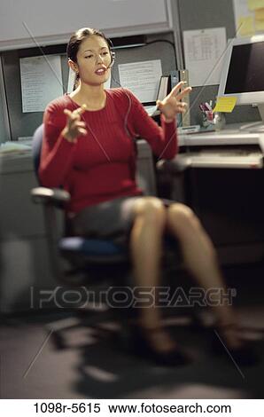 desk, woman, headset, talking, Asian, computer, business View Large Photo Image Stock Photography - desk, woman, headset, talking, Asian, computer, business. Fotosearch