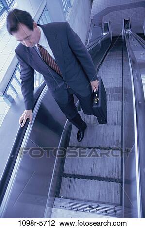 escalator, business, Middle-aged, businessman View Large Photo Image Stock Image - escalator, business, Middle-aged, businessman. Fotosearch