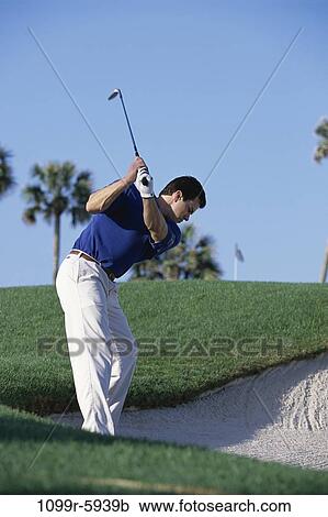 Stock Image - Field, playing, golf, trees, outdoors, Middle-aged. Fotosearch