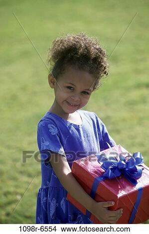 grass, girl, outdoors, carrying, sweet, child, gift View Large Photo Image Picture - grass, girl, outdoors, carrying, sweet, child, gift. Fotosearch