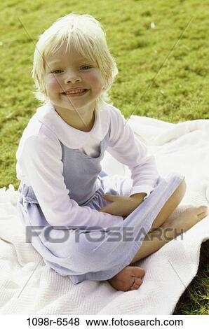 Stock Photo - grass, girl, outdoors, sweet, child, blond, fair. Fotosearch