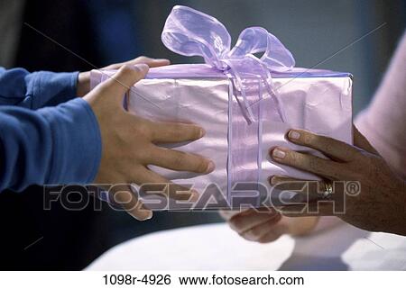 hands, birthday, surprise, gift, present, giving, bow View Large Photo Image Stock Photograph - hands, birthday, surprise, gift, present, giving, bow. Fotosearch