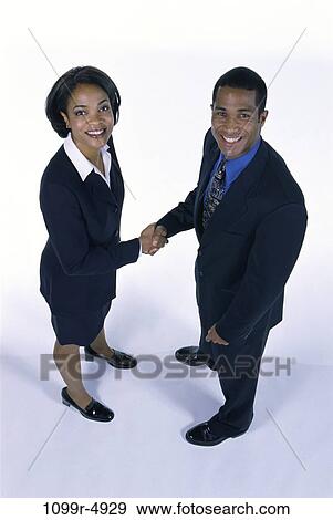 hands, standing, business, shaking, stand, shake, handshake View Large Photo Image Stock Photo - hands, standing, business, shaking, stand, shake, handshake. Fotosearch