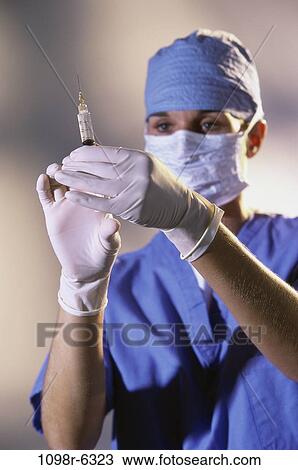 industry, woman, scrubs, needle, doctor, medicine, accuracy View Large Photo Image Stock Image - industry, woman, scrubs, needle, doctor, medicine, accuracy. Fotosearch