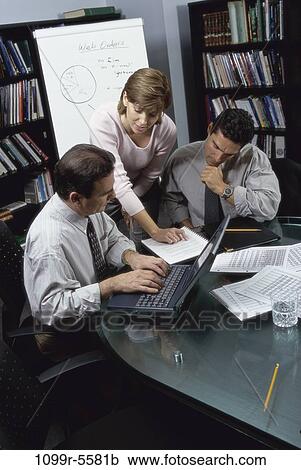 Stock Image - meeting, computer, laptop, typing, business, Middle-aged, using. Fotosearch