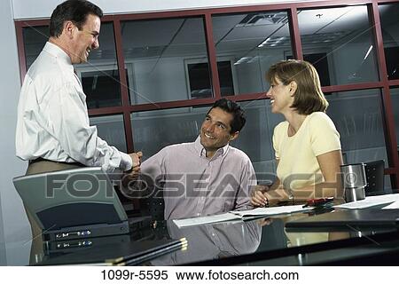 meeting, laptop, business, Middle-aged, handshake, Caucasian, businesspeople View Large Photo Image Stock Photography - meeting, laptop, business, Middle-aged, handshake, Caucasian, businesspeople. Fotosearch