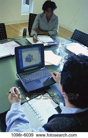 meeting, multiethnic, presentation, laptop, business, indoors, casual dress View Large Photo Image Stock Photo - meeting, multiethnic, presentation, laptop, business, indoors, casual dress. Fotosearch