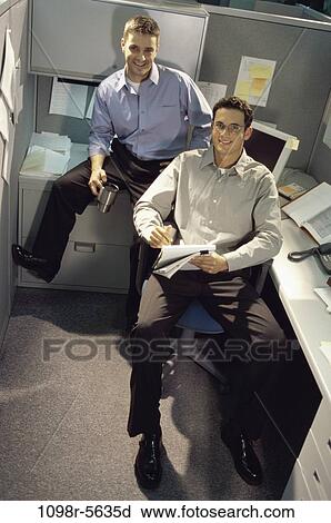 Stock Image - men, desk, business, businessmen, casual, indoors, Caucasian. Fotosearch