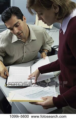 multiethnic, desk, business, Middle-aged, teamwork, casual, indoors View Large Photo Image Stock Image - multiethnic, desk, business, Middle-aged, teamwork, casual, indoors. Fotosearch