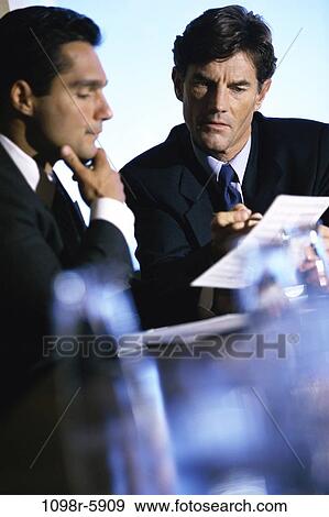 Stock Photo - multiethnic, men, consultation, business, Middle-aged, meetings, businessmen. Fotosearch