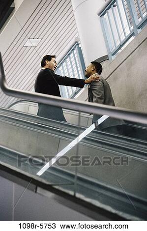 multiethnic, men, people, escalator, business, Middle-aged, businessmen View Large Photo Image Stock Image - multiethnic, men, people, escalator, business, Middle-aged, businessmen. Fotosearch