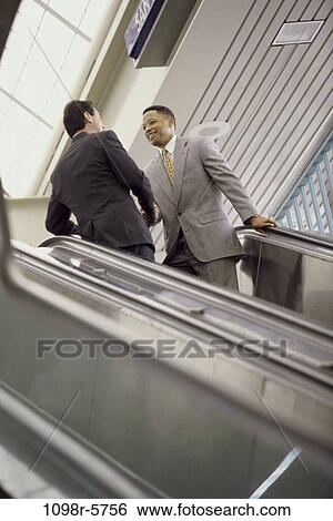 multiethnic, men, people, escalator, business, Middle-aged, greeting View Large Photo Image Stock Photograph - multiethnic, men, people, escalator, business, Middle-aged, greeting. Fotosearch