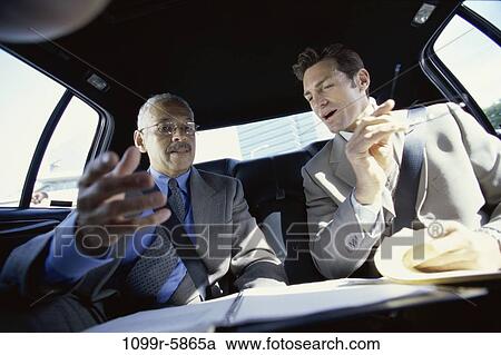 Stock Image - multiethnic, men, talking, car, business, businessmen, travel. Fotosearch