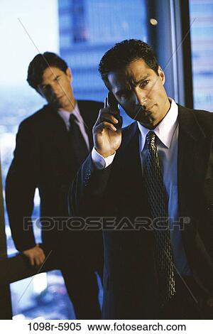 Stock Photography - multiethnic, men, talking, phone, business, Middle-aged, businessmen. Fotosearch