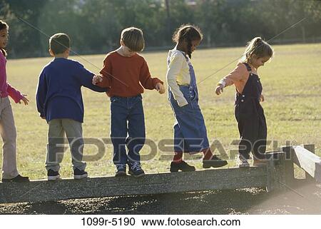 multiethnic, people, balance, walking, outdoors, children, balancing View Large Photo Image Stock Image - multiethnic, people, balance, walking, outdoors, children, balancing. Fotosearch