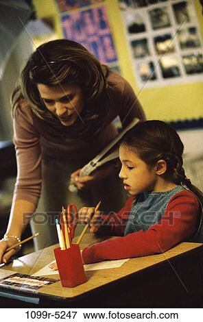 multiethnic, people, desk, teacher, school, classroom, commitment View Large Photo Image Stock Photo - multiethnic, people, desk, teacher, school, classroom, commitment. Fotosearch