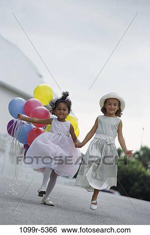 multiethnic, people, party, formal, walking, balloons, windy View Large Photo Image Stock Photograph - multiethnic, people, party, formal, walking, balloons, windy. Fotosearch