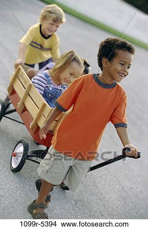 multiethnic, people, playing, riding, outdoors, pulling, friends View Large Photo Image Picture - multiethnic, people, playing, riding, outdoors, pulling, friends. Fotosearch