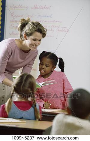 multiethnic, people, teacher, school, reading, classroom, studying View Large Photo Image Stock Photo - multiethnic, people, teacher, school, reading, classroom, studying. Fotosearch