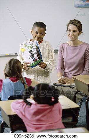 multiethnic, people, teacher, school, classroom, showing, education View Large Photo Image Stock Photography - multiethnic, people, teacher, school, classroom, showing, education. Fotosearch