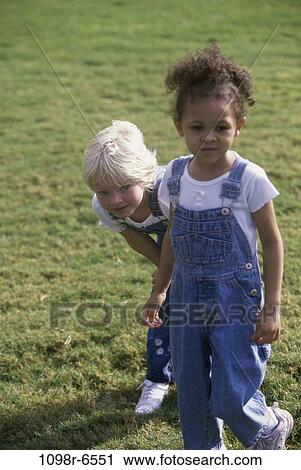 Stock Image - multiethnic, people, walking, outdoors, children, girls. Fotosearch