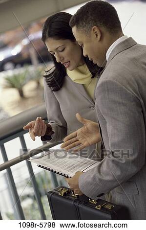multiethnic, railing, talking, discussion, conversation, papers, business View Large Photo Image Stock Photo - multiethnic, railing, talking, discussion, conversation, papers, business. Fotosearch