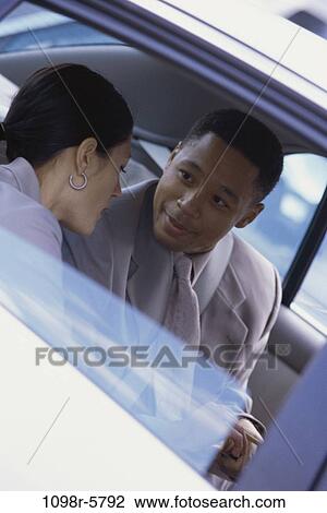 multiethnic, talking, car, riding, business, ride, travel View Large Photo Image Stock Image - multiethnic, talking, car, riding, business, ride, travel. Fotosearch