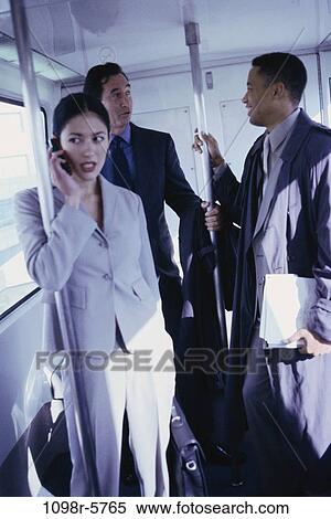 multiethnic, talking, phone, riding, business, Middle-aged, ride View Large Photo Image Stock Photography - multiethnic, talking, phone, riding, business, Middle-aged, ride. Fotosearch