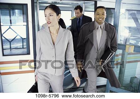 Stock Photograph - multiethnic, train, business, subway, leaving, departing, leave. Fotosearch