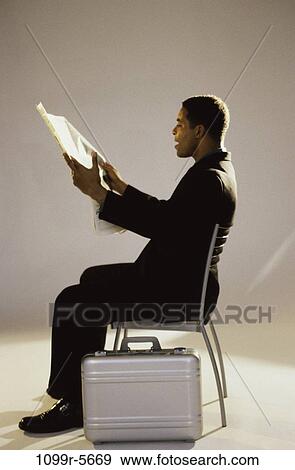 newspaper, briefcase, reading, business, Middle-aged, businessman View Large Photo Image Stock Photo - newspaper, briefcase, reading, business, Middle-aged, businessman. Fotosearch