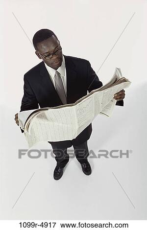 newspaper, eyeglasses, reading, business, businessman, indoors View Large Photo Image Stock Photo - newspaper, eyeglasses, reading, business, businessman, indoors. Fotosearch