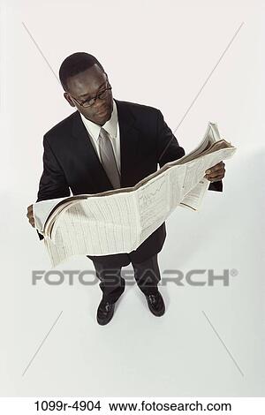paper, newspaper, eyeglasses, reading, business, finance View Large Photo Image Picture - paper, newspaper, eyeglasses, reading, business, finance. Fotosearch