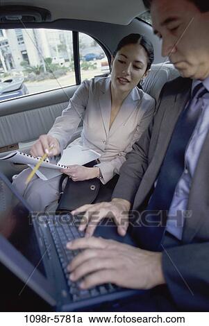 papers, computer, car, laptop, typing, business, using View Large Photo Image Stock Image - papers, computer, car, laptop, typing, business, using. Fotosearch