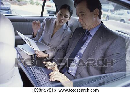 papers, computer, car, laptop, typing, business, using View Large Photo Image Stock Image - papers, computer, car, laptop, typing, business, using. Fotosearch