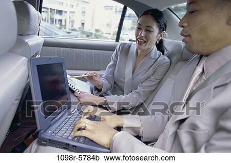 papers, computer, car, laptop, typing, business, using View Large Photo Image Stock Image - papers, computer, car, laptop, typing, business, using. Fotosearch