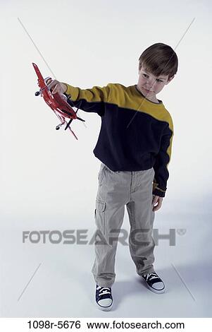 Stock Photograph - people, airplane, playing, boy, child, play, toy. Fotosearch