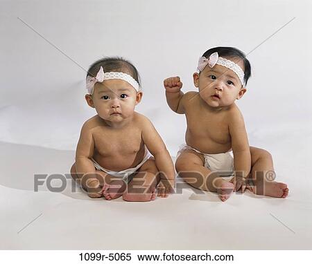 people, Asian, babies, brunette, pair, twins, indoors View Large Photo Image Stock Photography - people, Asian, babies, brunette, pair, twins, indoors. Fotosearch