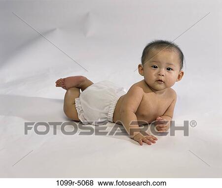 people, Asian, baby, brunette, lying, indoors, Babies various View Large Photo Image Stock Photo - people, Asian, baby, brunette, lying, indoors, Babies various. Fotosearch