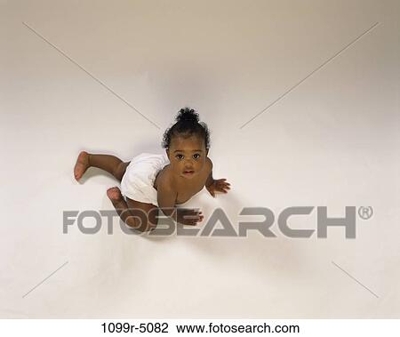 people, baby, crawling, brunette, indoors, African-American, crawl View Large Photo Image Stock Image - people, baby, crawling, brunette, indoors, African-American, crawl. Fotosearch