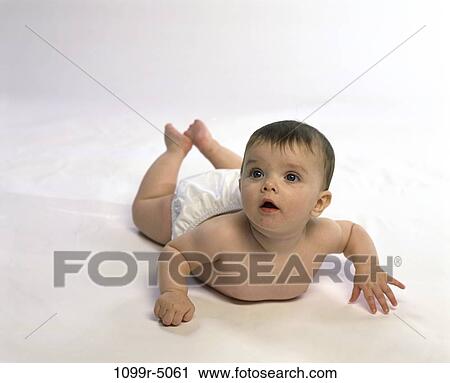 people, baby, curious, brunette, lying, indoors, Caucasian View Large Photo Image Stock Image - people, baby, curious, brunette, lying, indoors, Caucasian. Fotosearch
